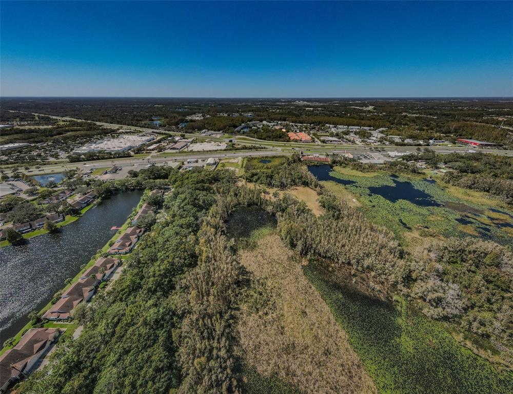 an aerial view of a houses with a yard