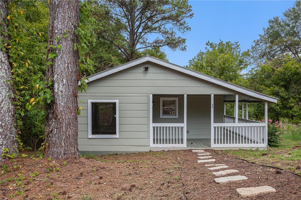 a front view of a house with a porch