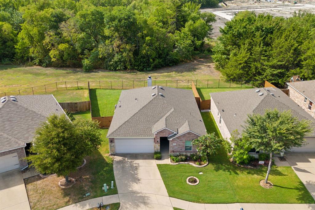 an aerial view of a house with a garden