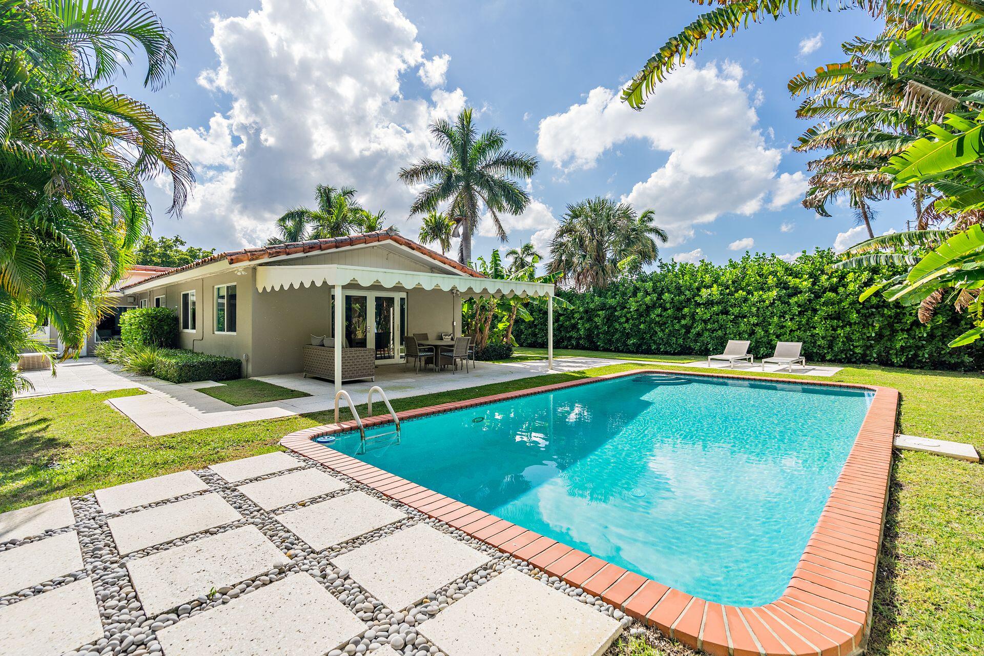 swimming pool with outdoor seating yard and barbeque oven