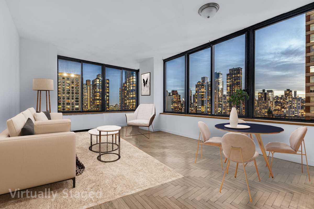 a living room with furniture and a large window