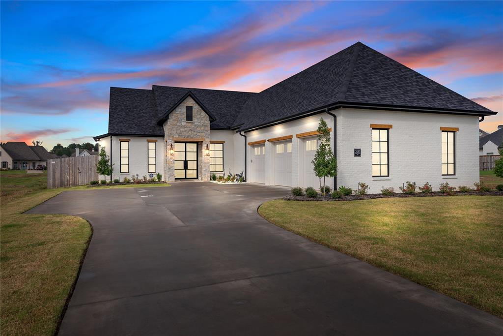 a front view of a house with yard