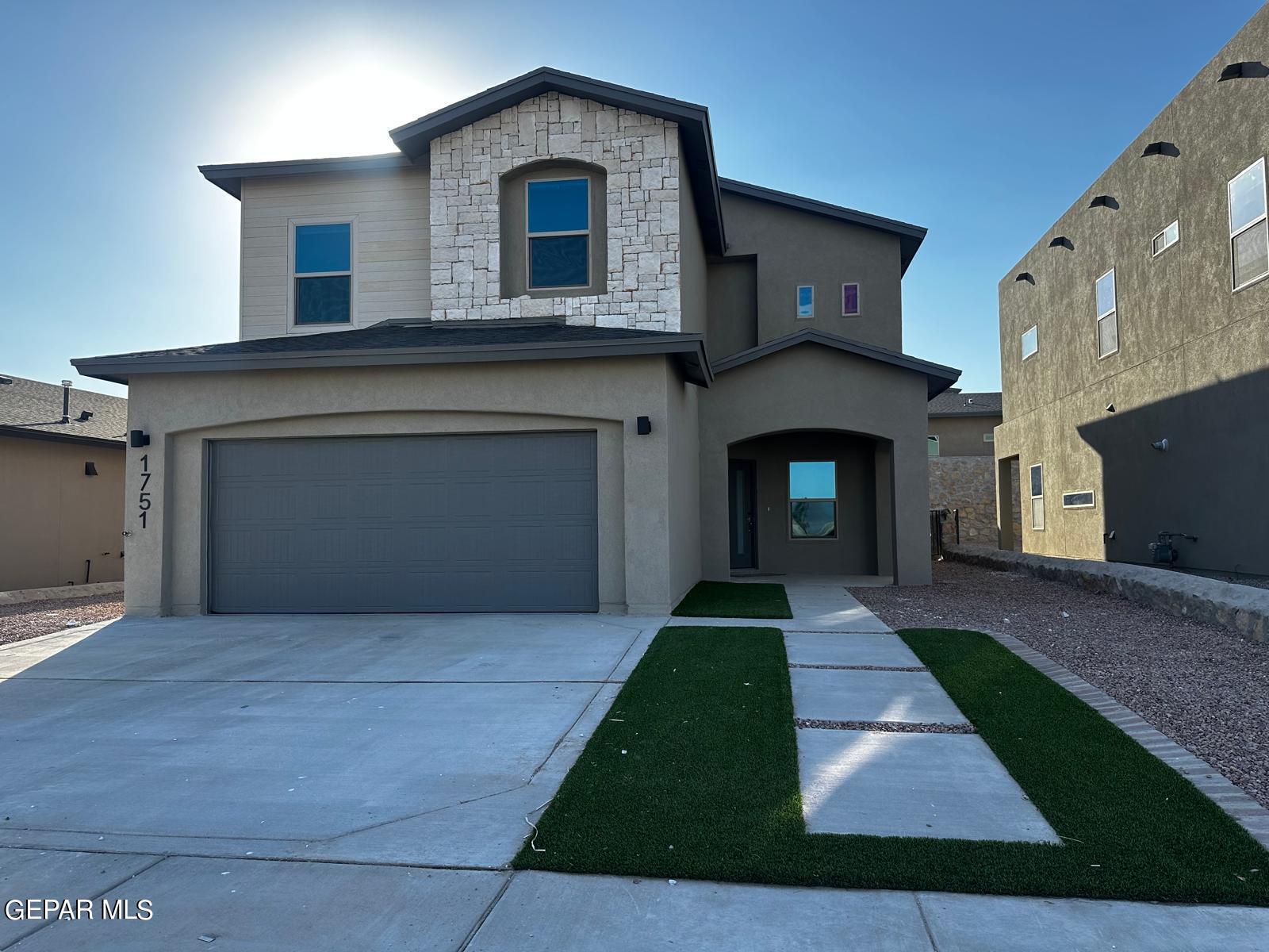 a front view of a house with yard