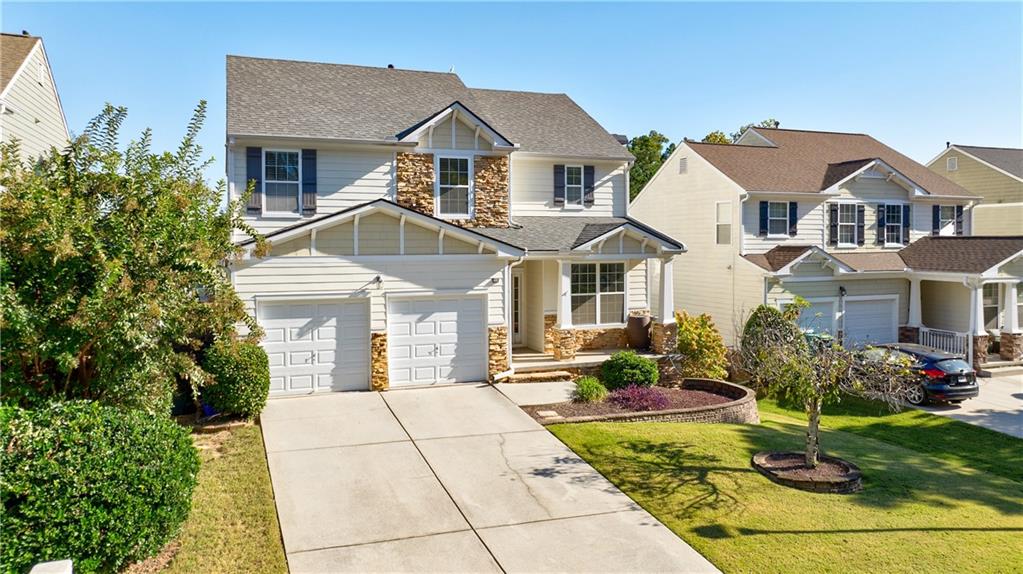 a front view of a house with garden