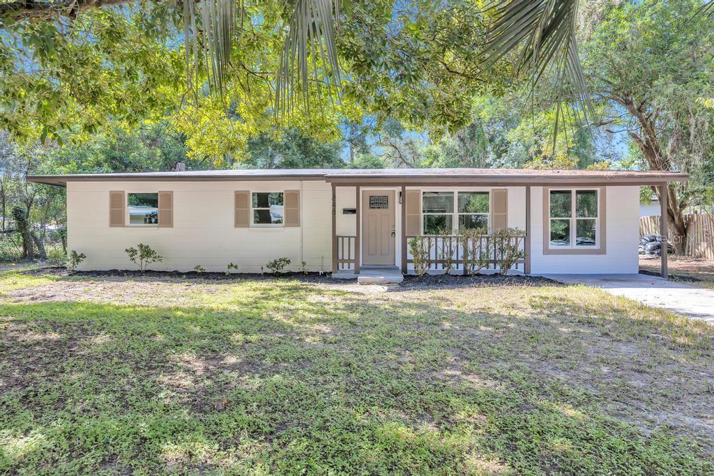 front view of a house with a yard