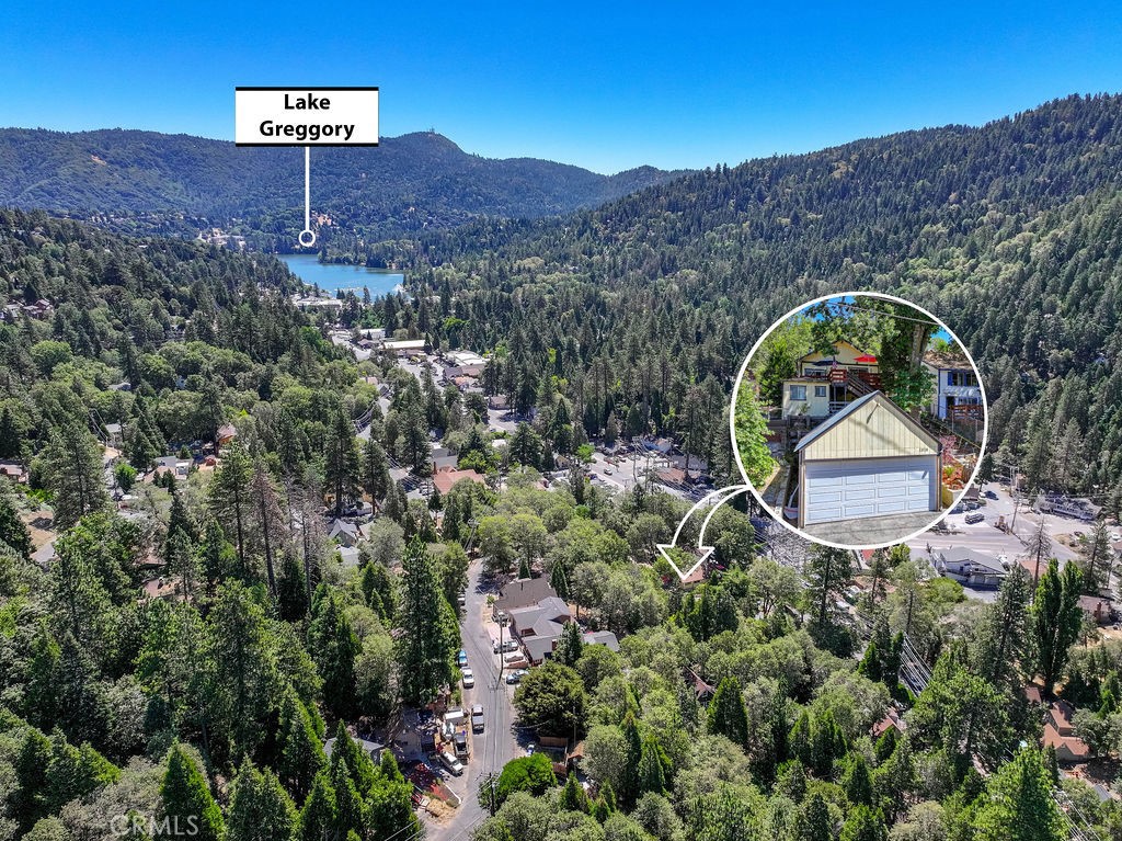 an aerial view of a house with a mountain view