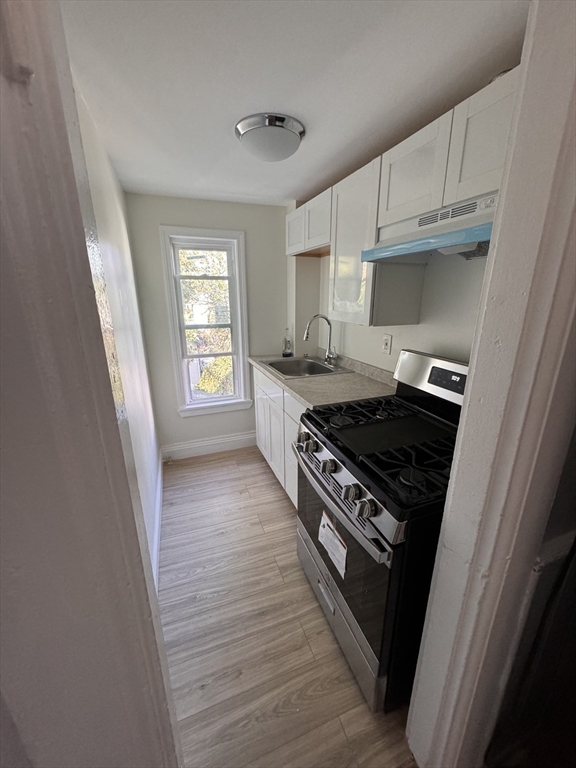 a kitchen with a stove and a refrigerator