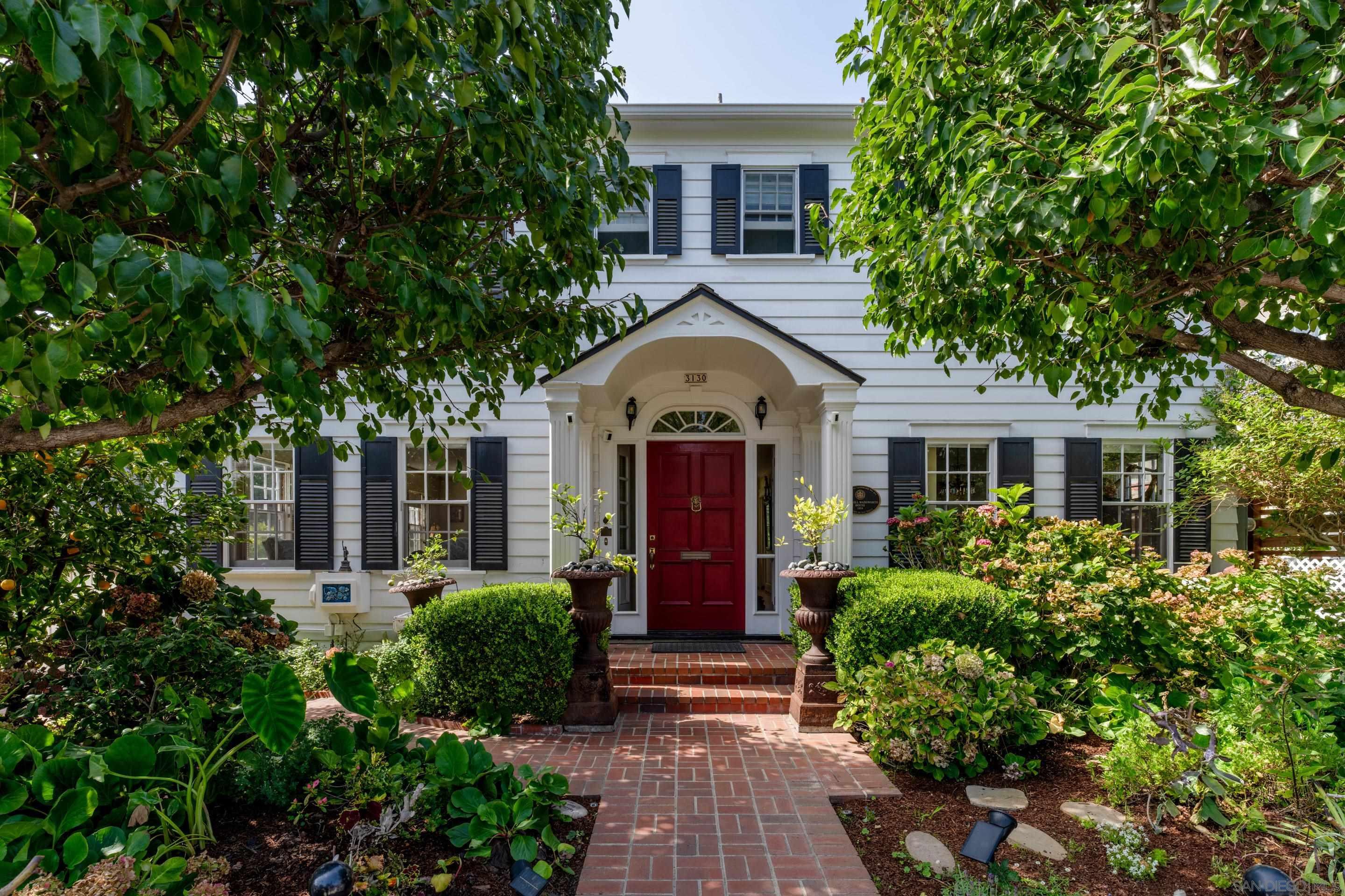 a front view of a house with garden