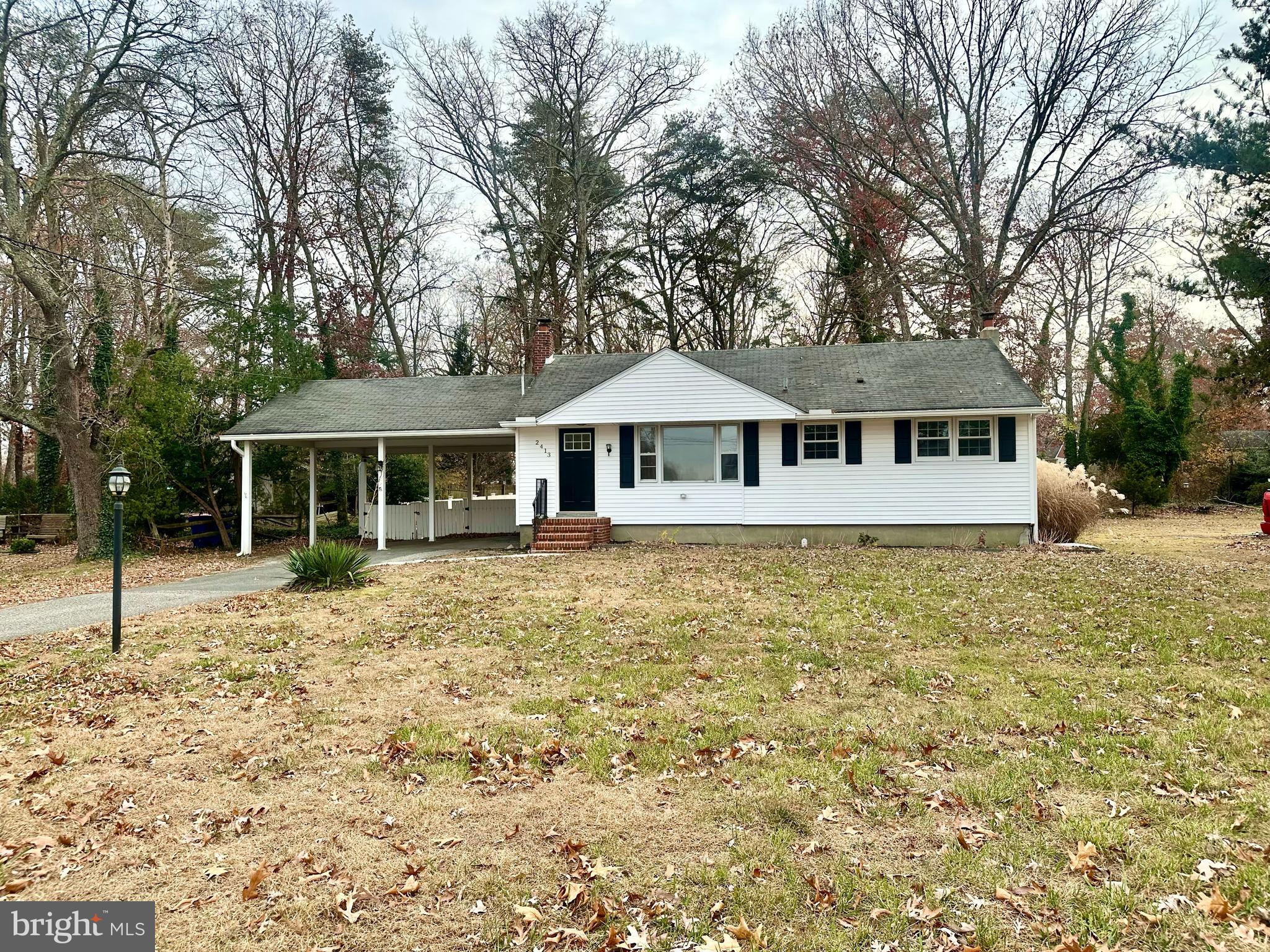 a house with trees in the background