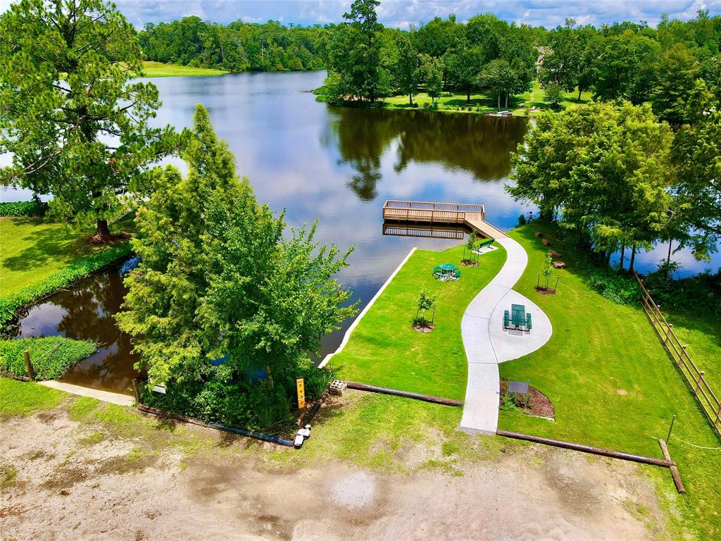 a view of a lake with a swimming pool and outdoor space