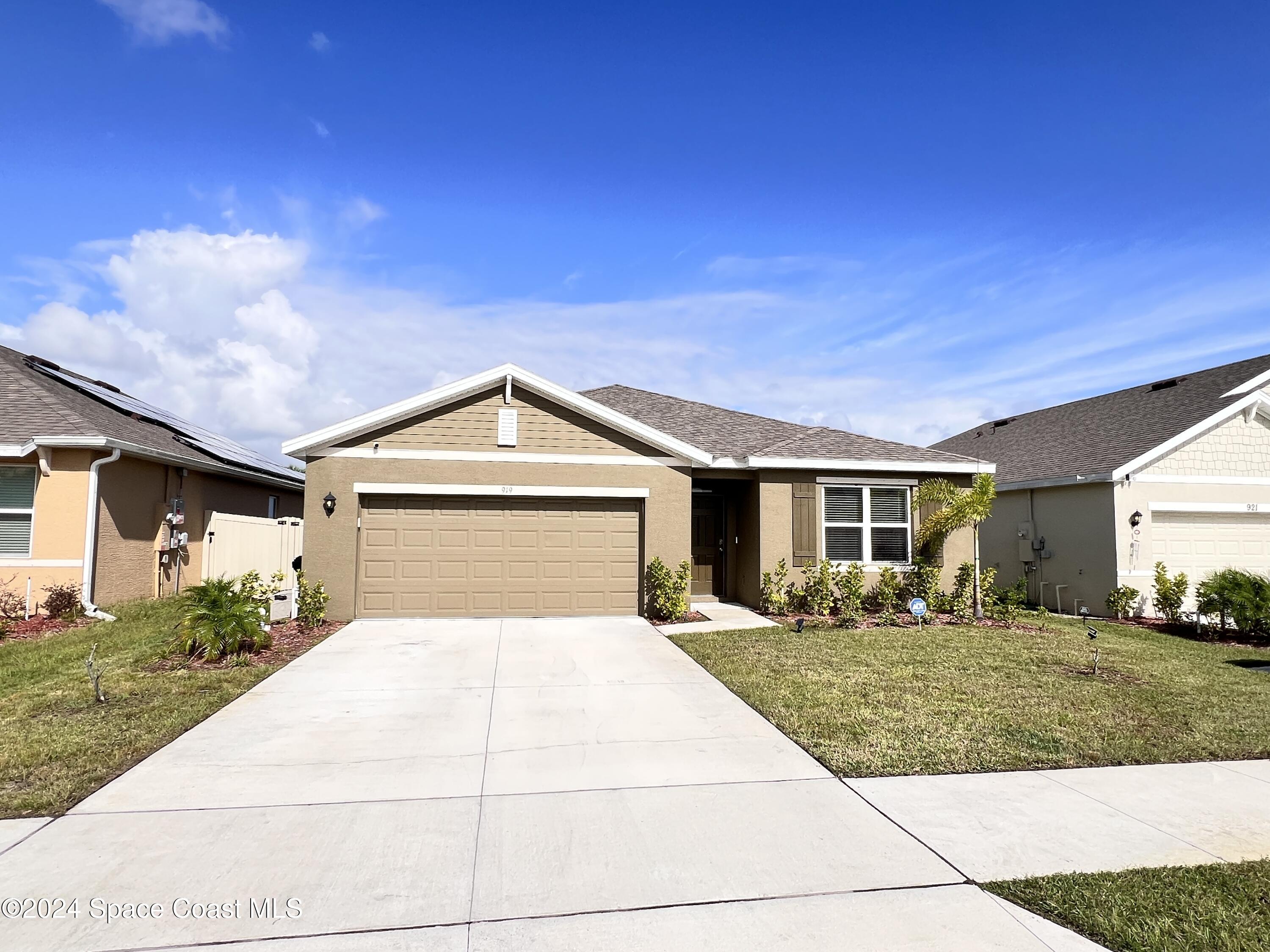 a front view of a house with yard