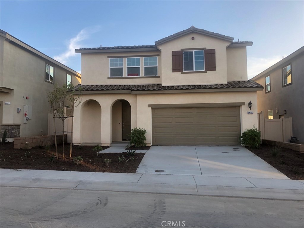 a front view of a house with a garage