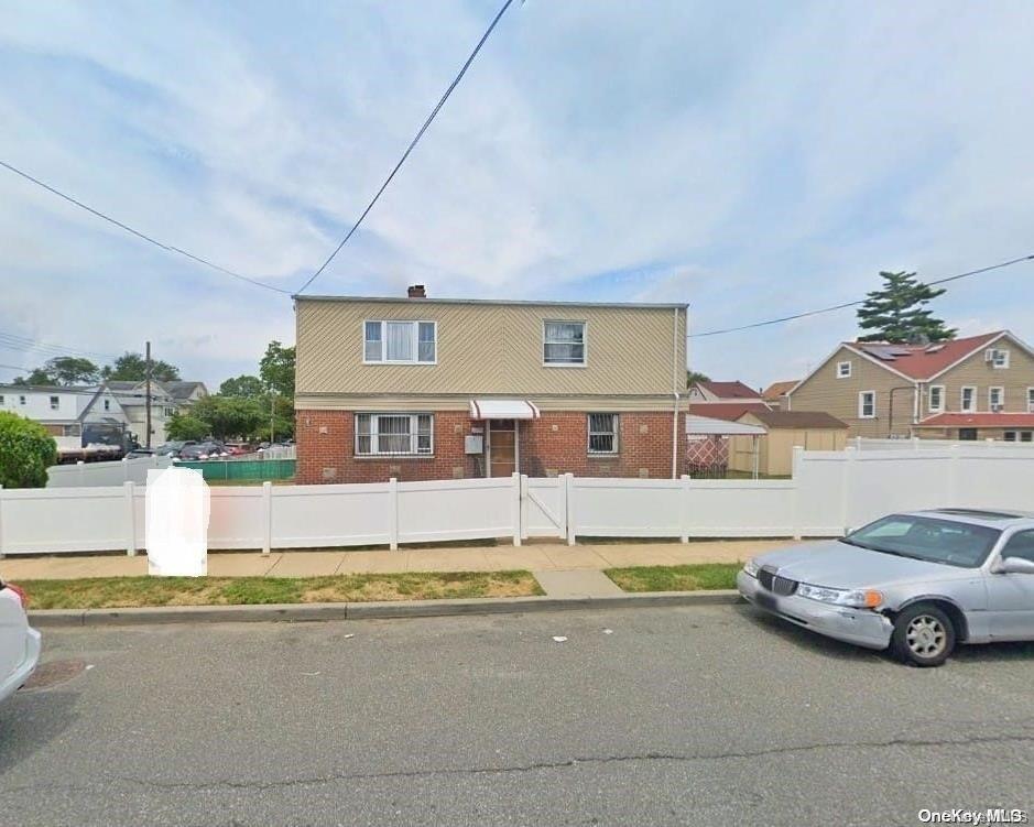 a car parked in front of a house