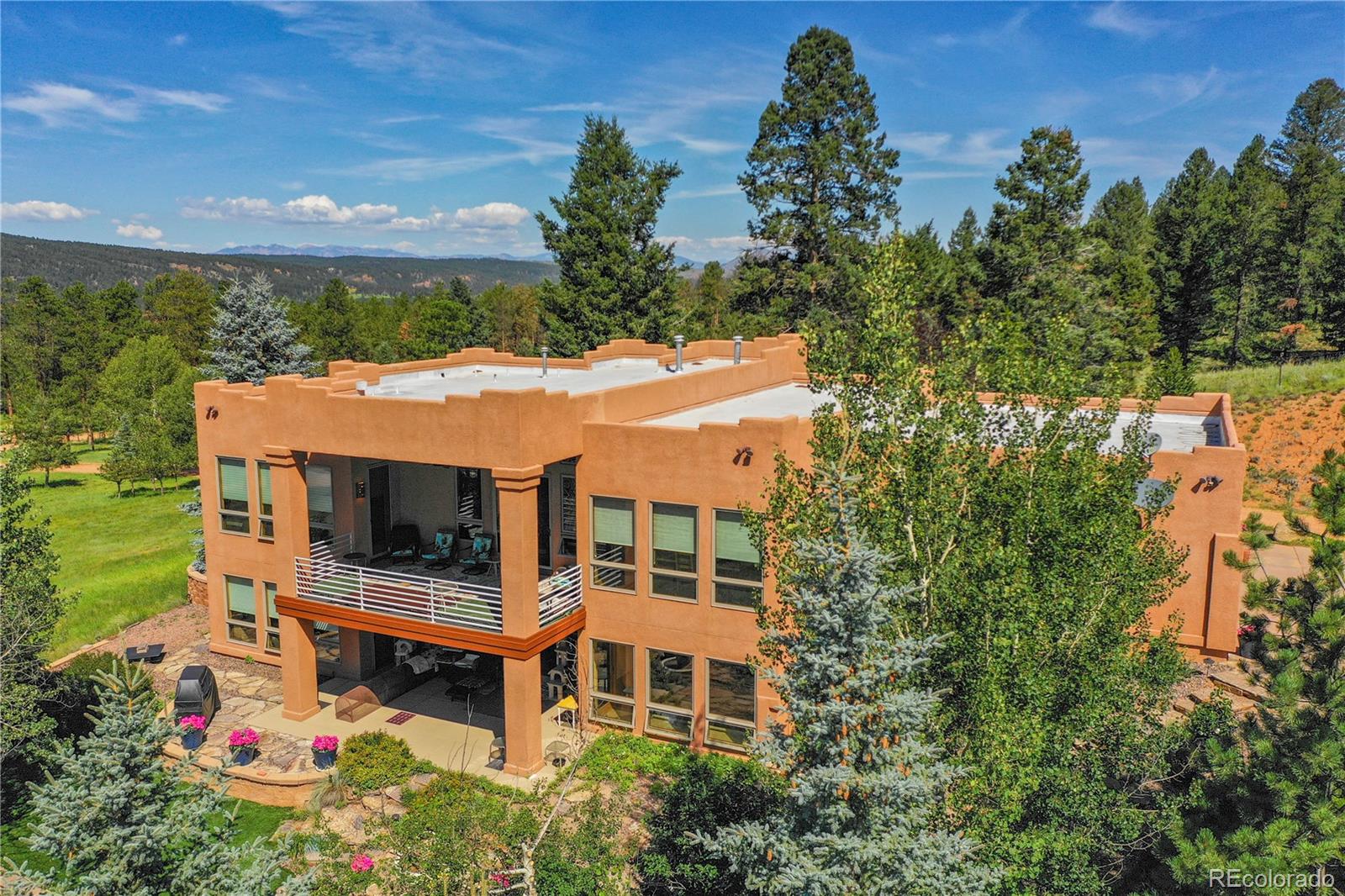 a aerial view of a house with yard