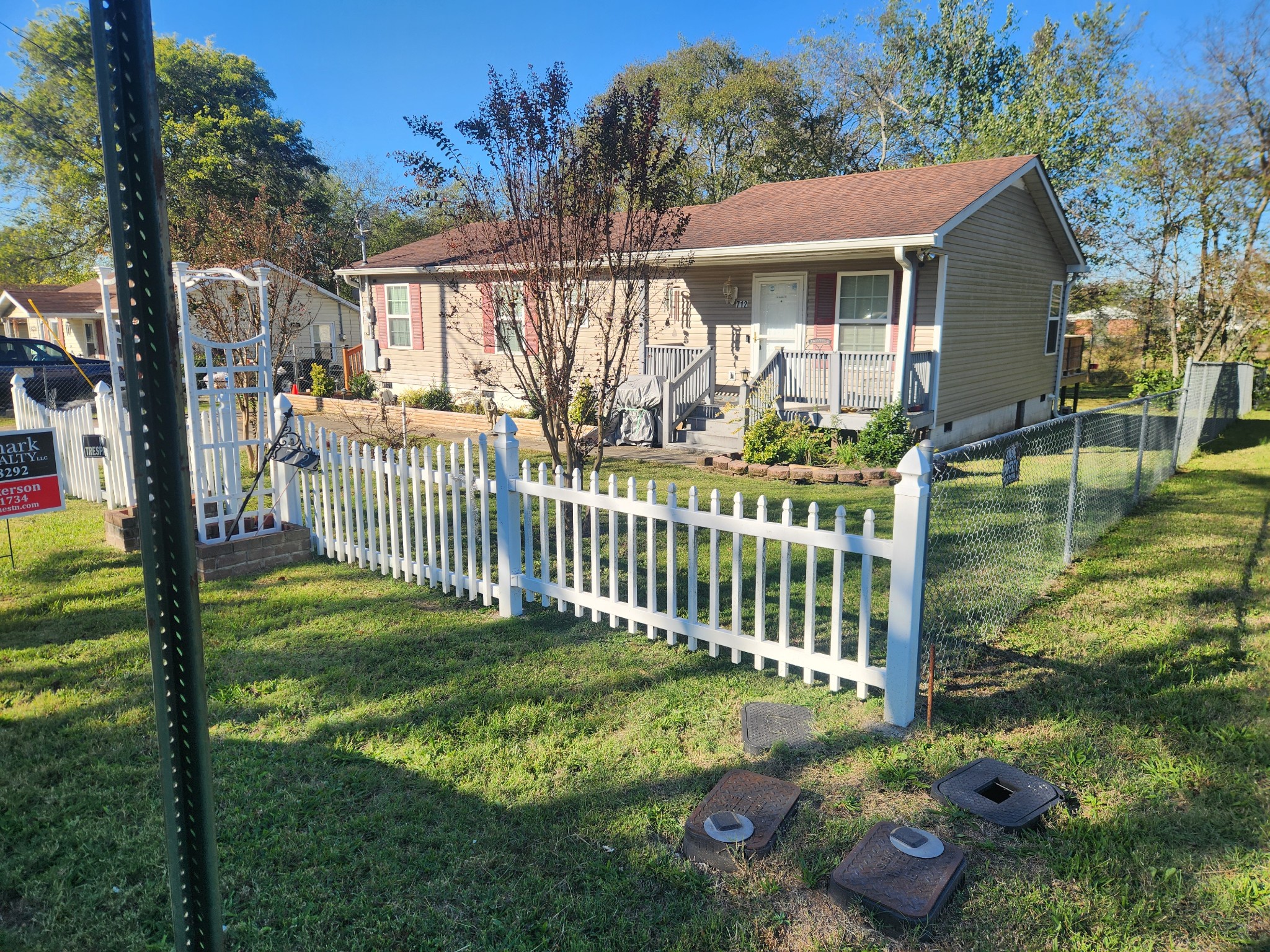 a view of a house with backyard and porch