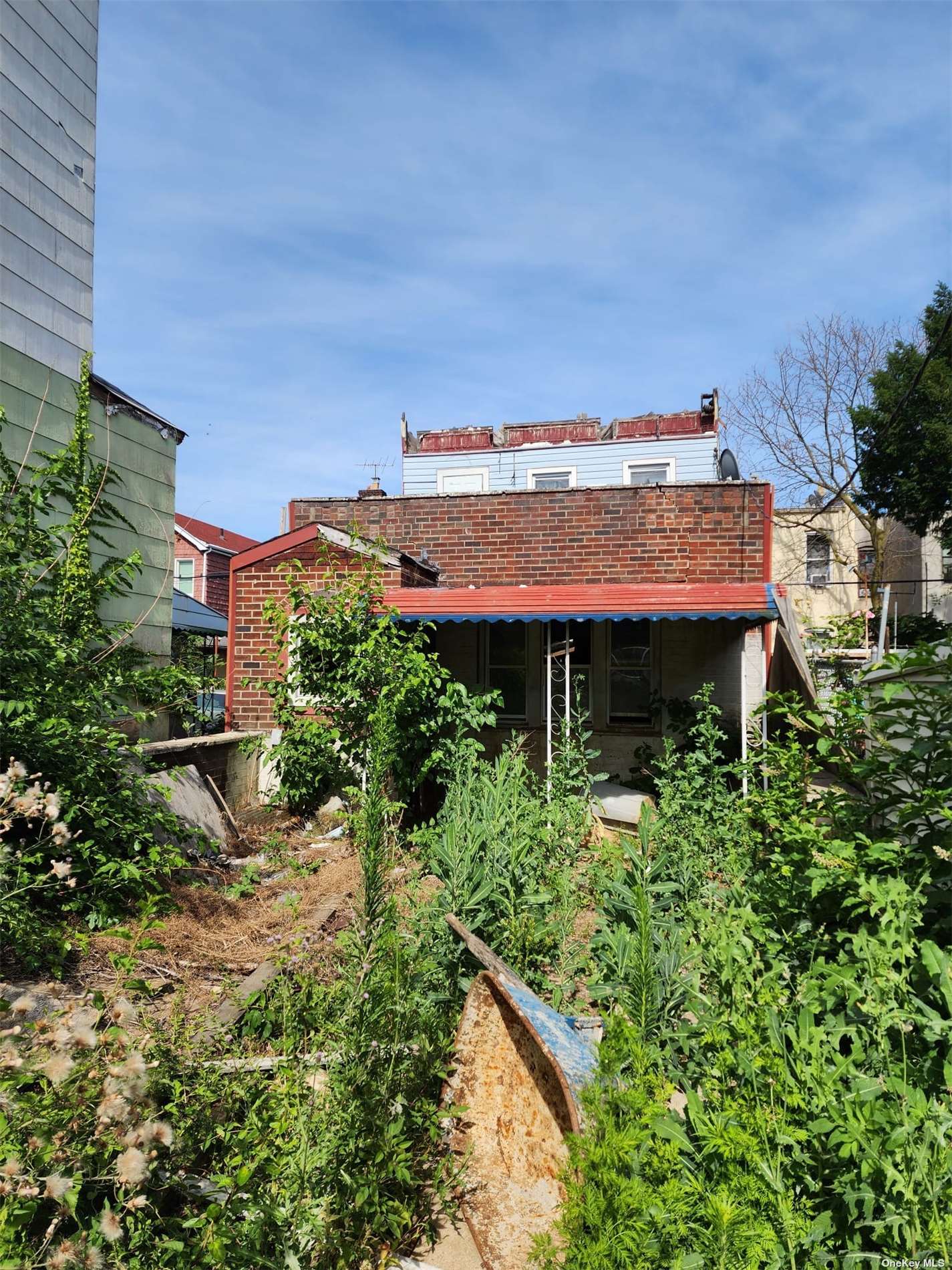 an aerial view of a house with a yard and potted plants