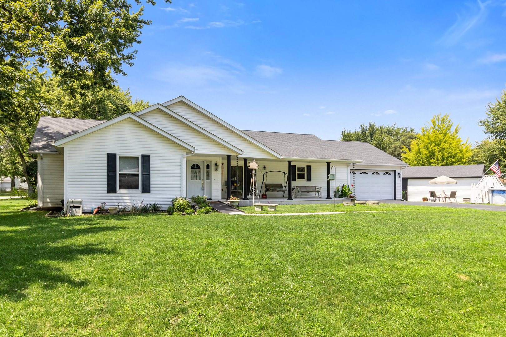 a front view of house with yard and green space