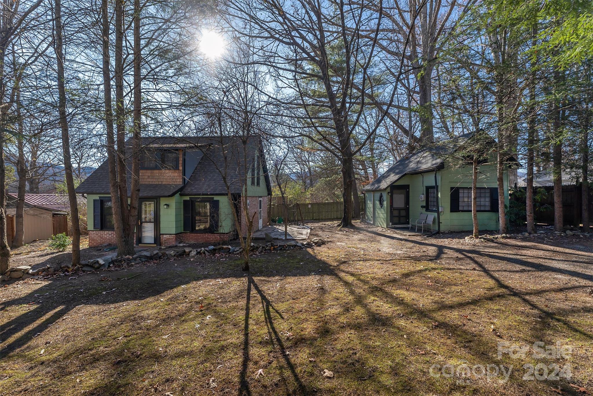 a view of a house with trees in the background