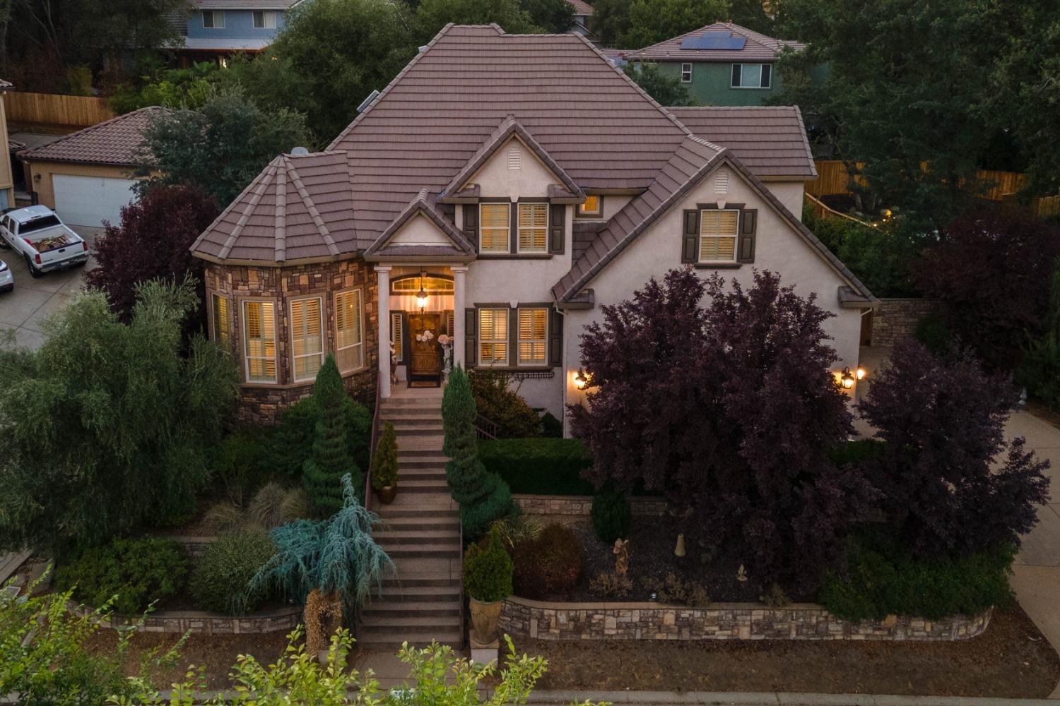 a front view of a house with garden