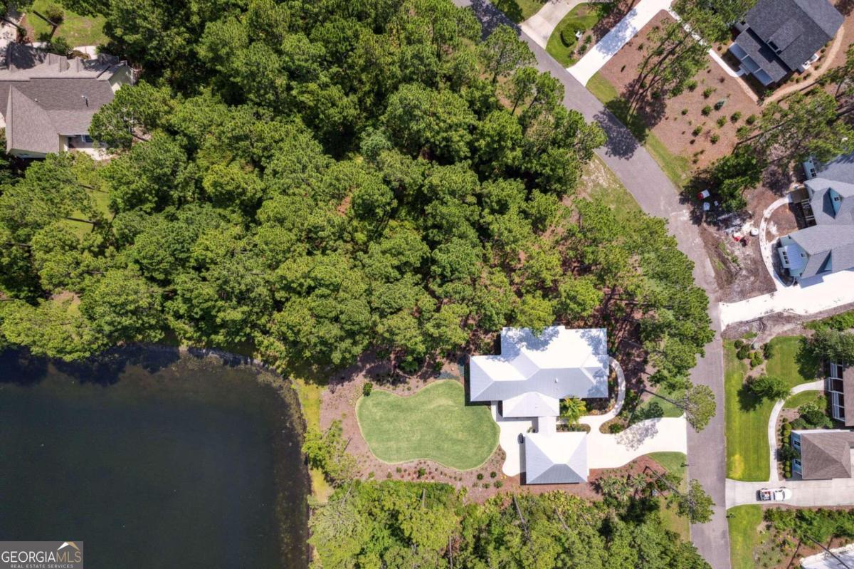 an aerial view of a house with outdoor space