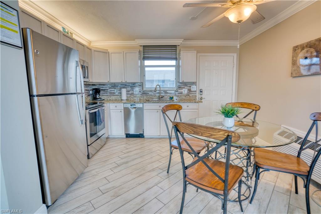 a dining room with furniture and window