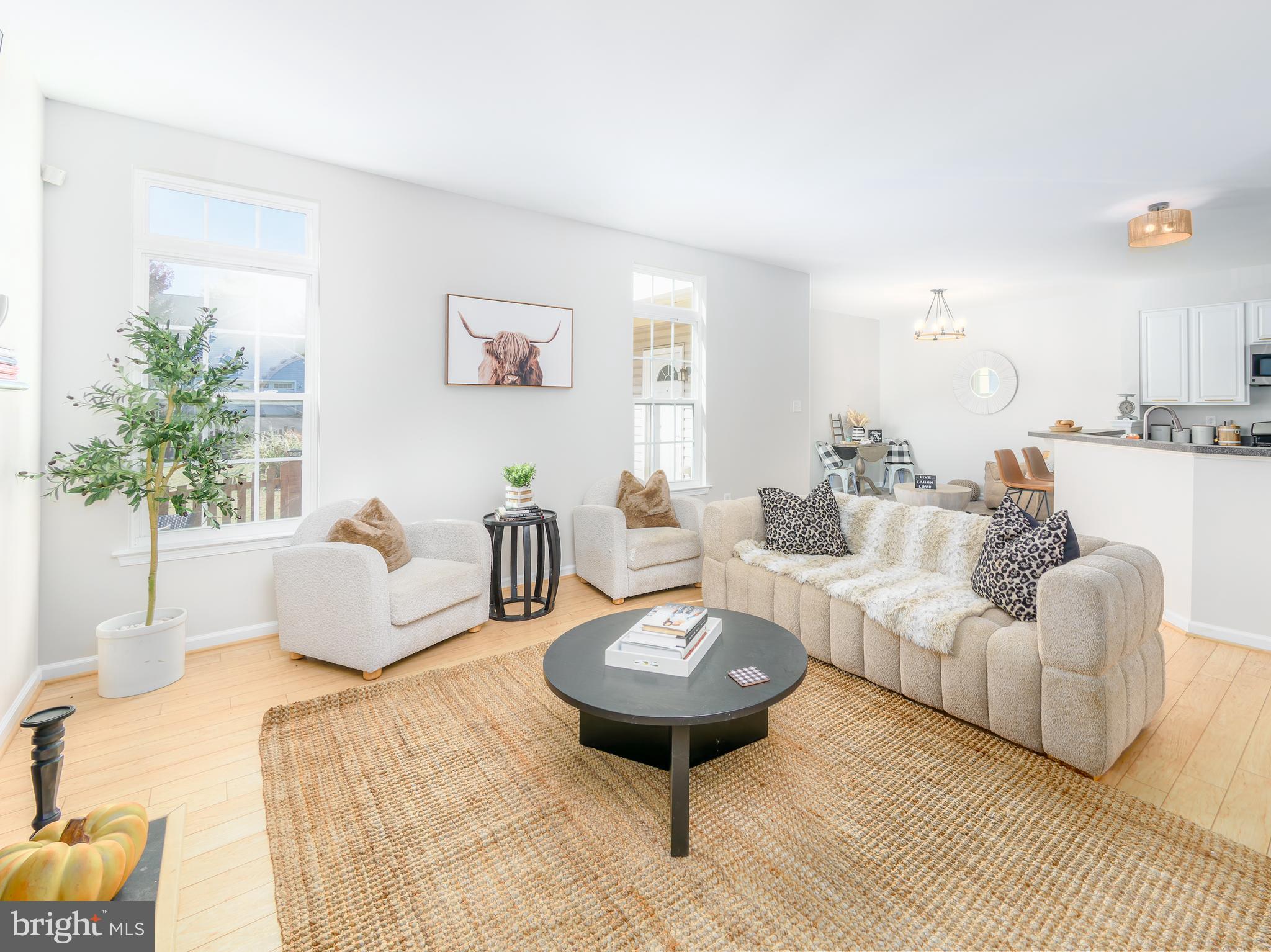 a living room with furniture and a table