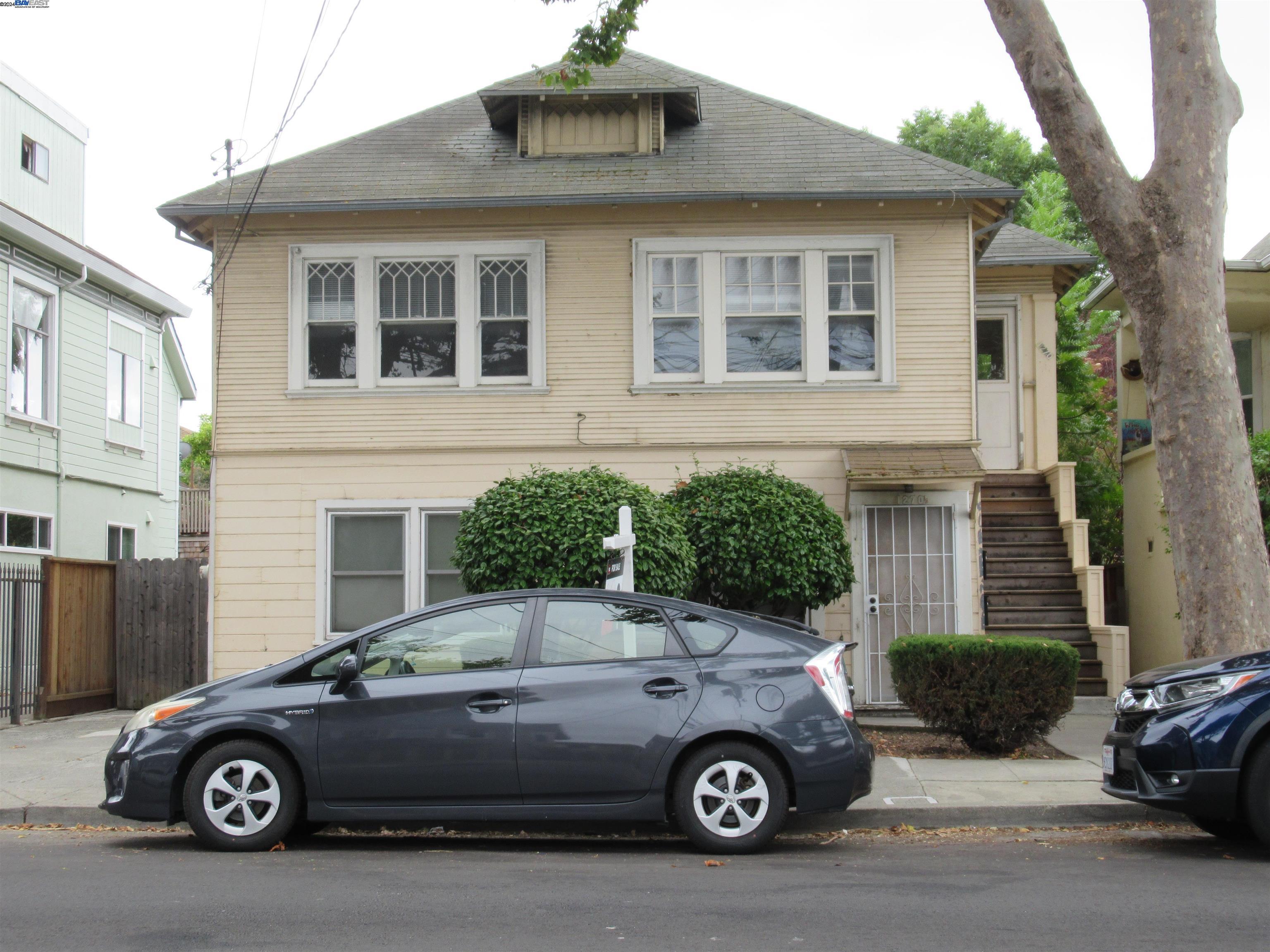 a car parked in front of a house