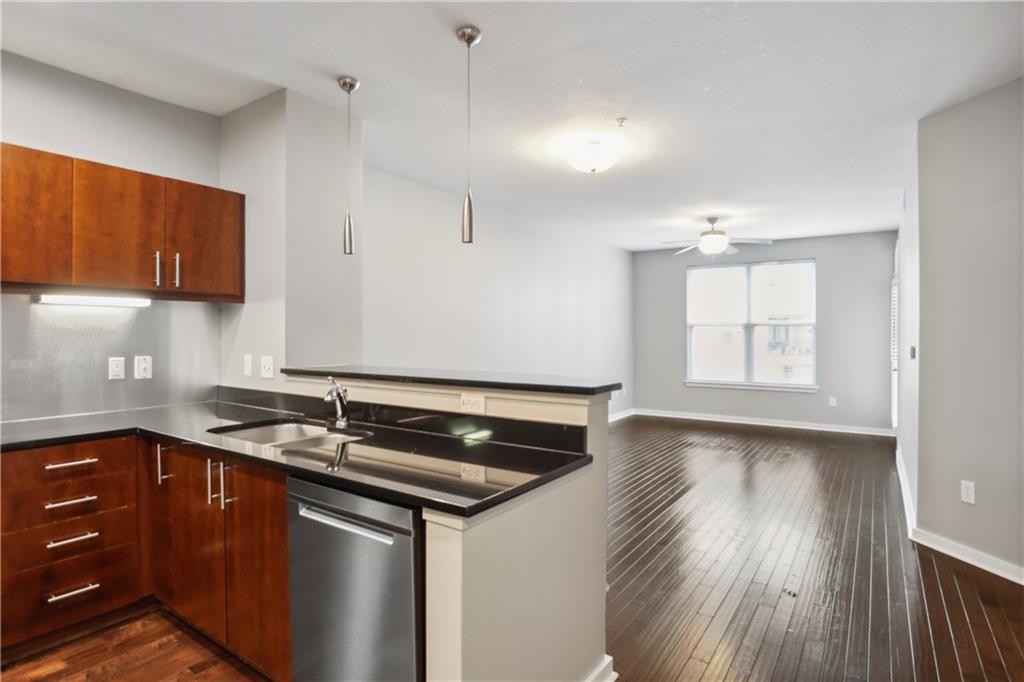 a kitchen with a sink and cabinets