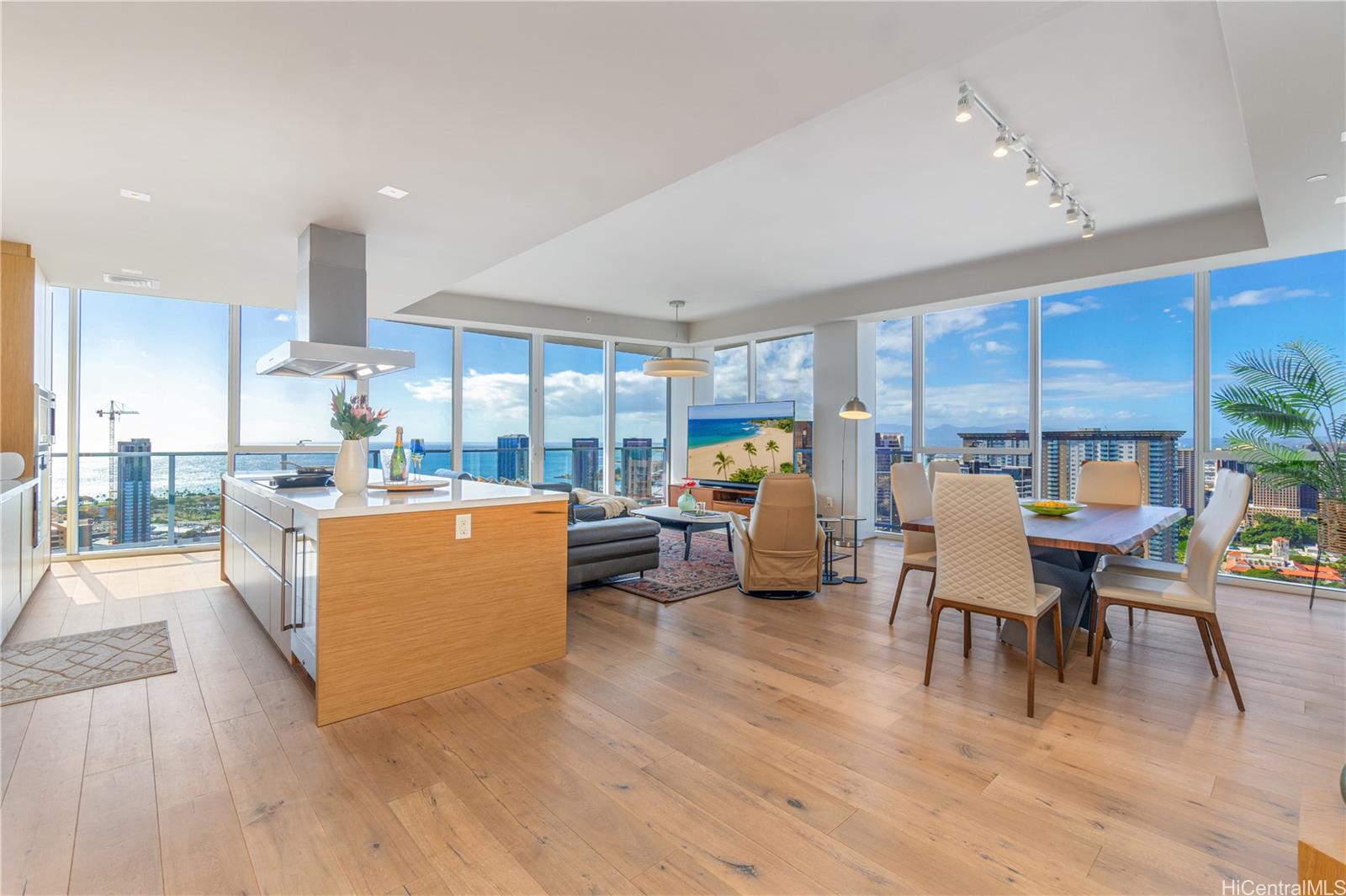 a living room with furniture dining table and a large window