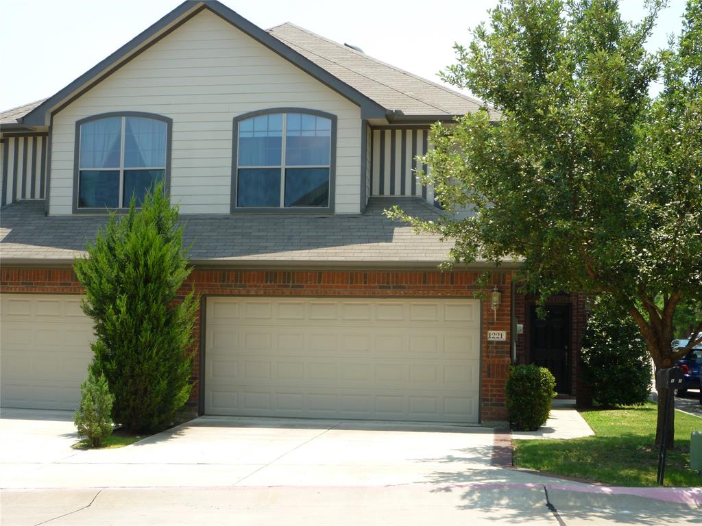 a front view of house with garage and yard