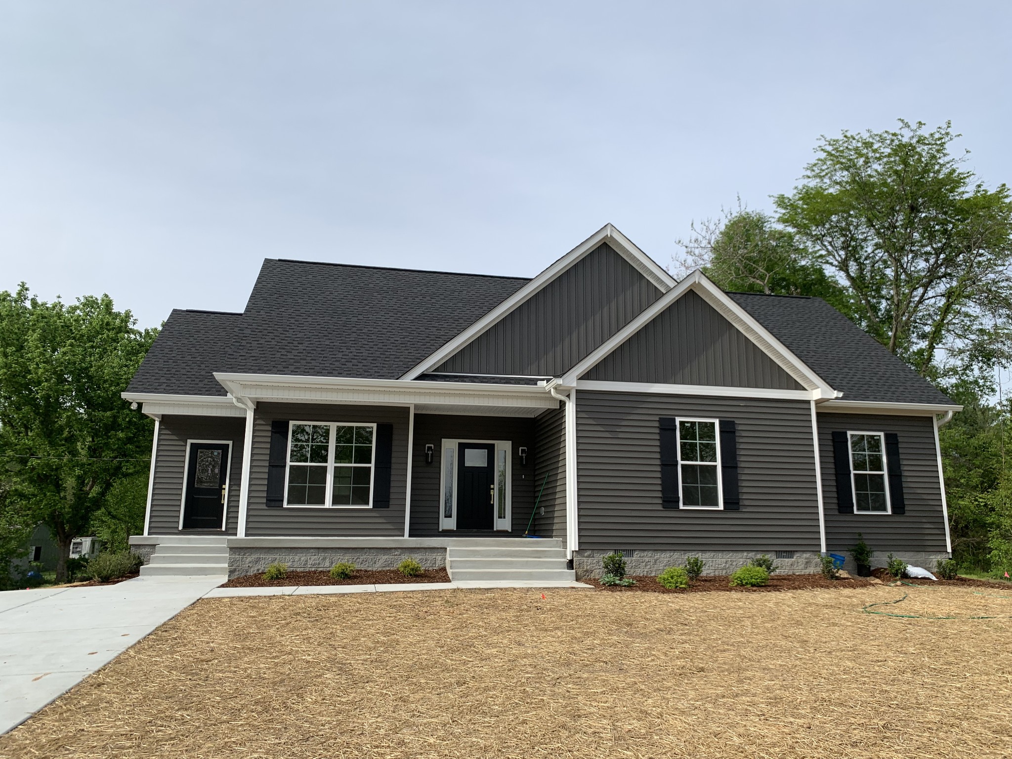 a front view of a house with a yard