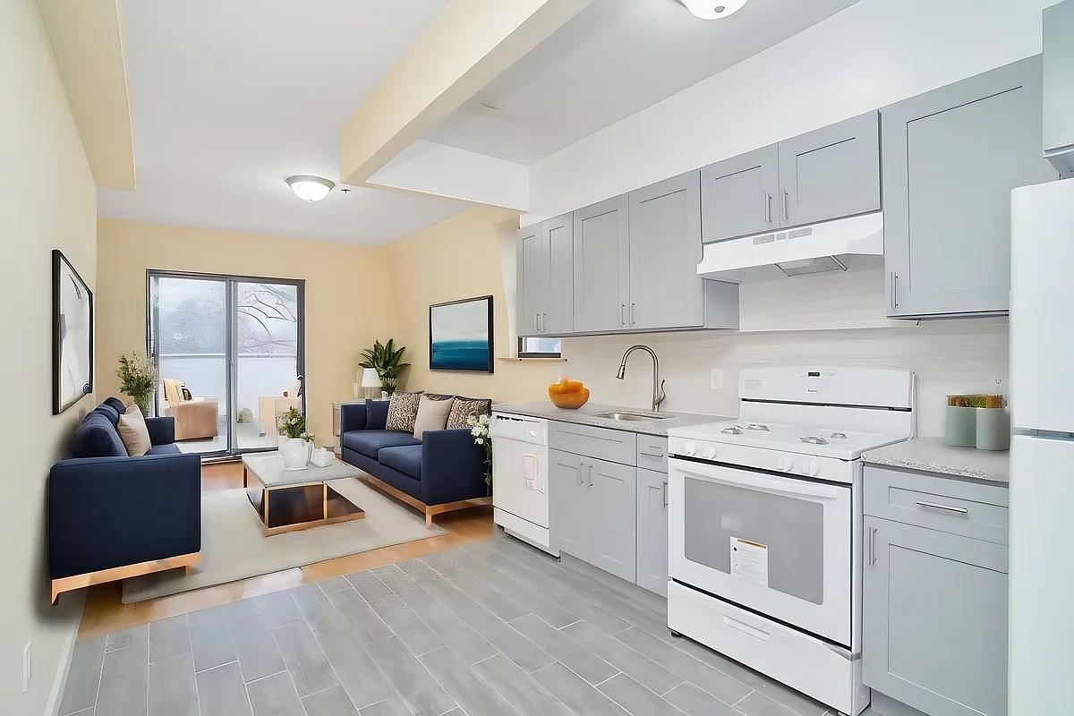 a view of living room with furniture and flat screen tv