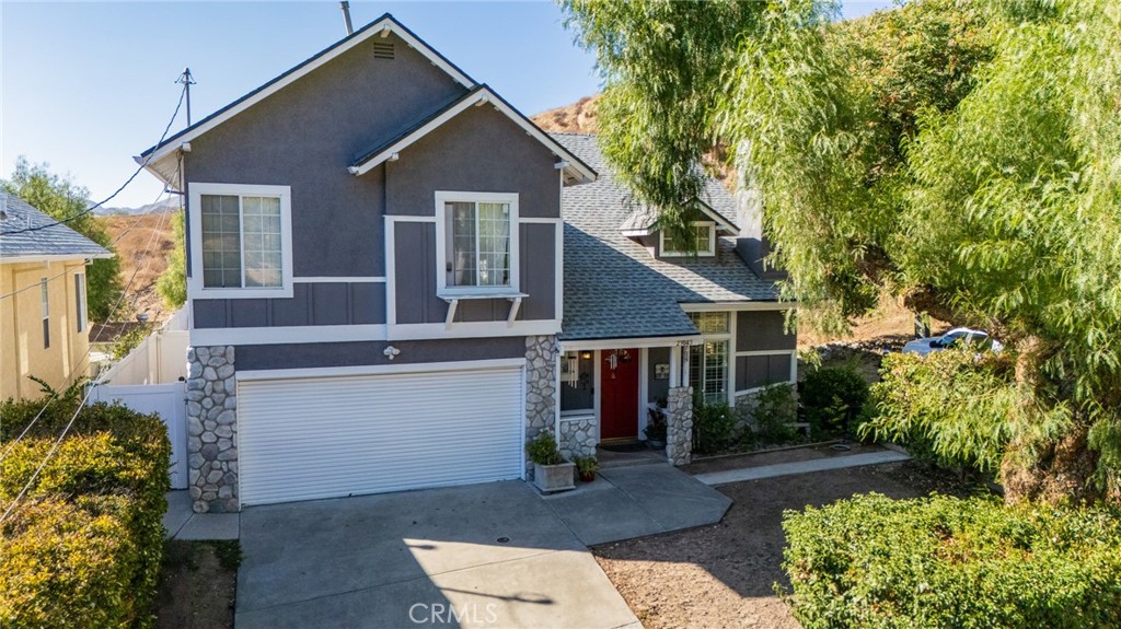 front view of a house with a small yard