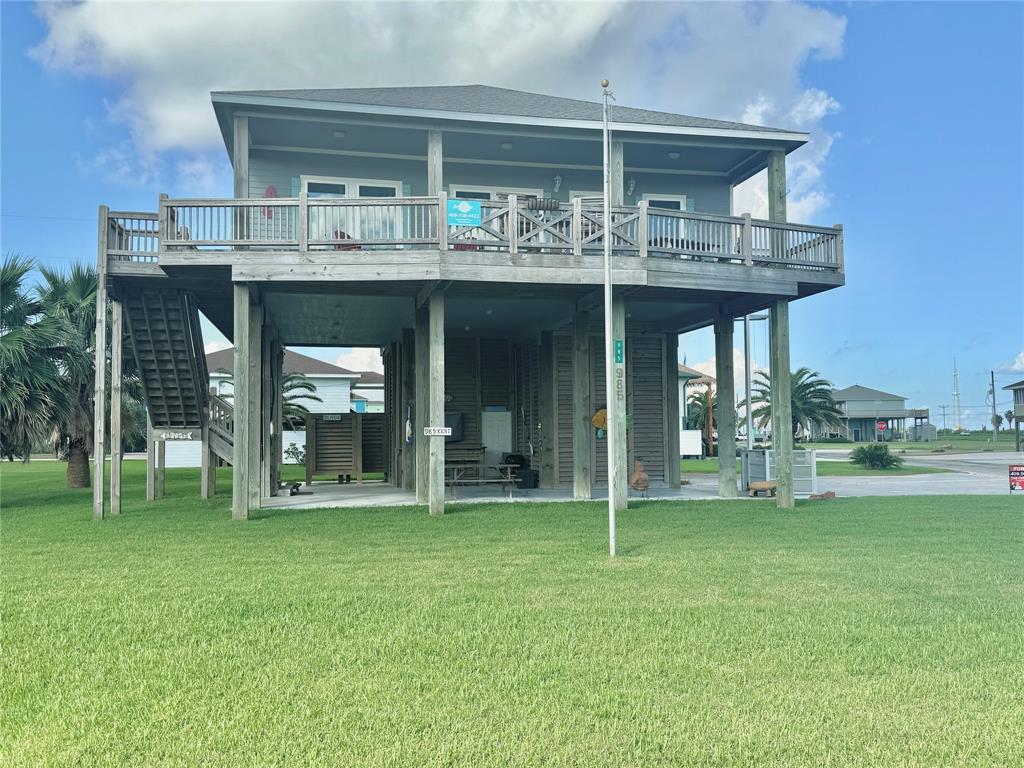 a view of a house with pool and a yard