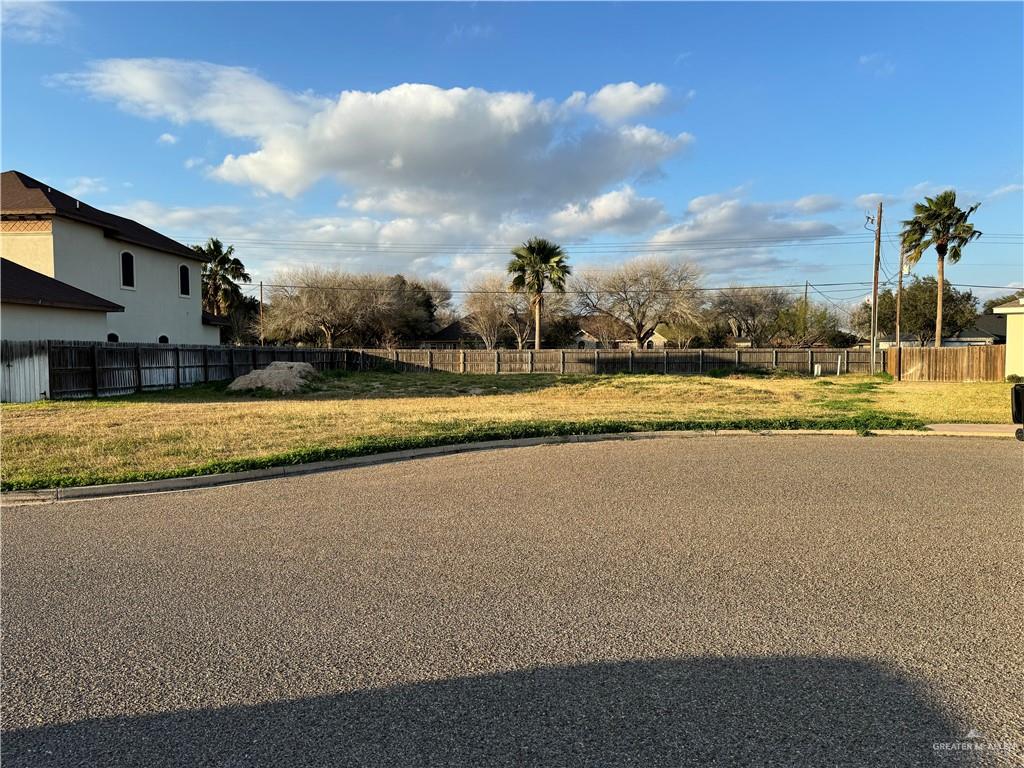 a view of a swimming pool and a yard