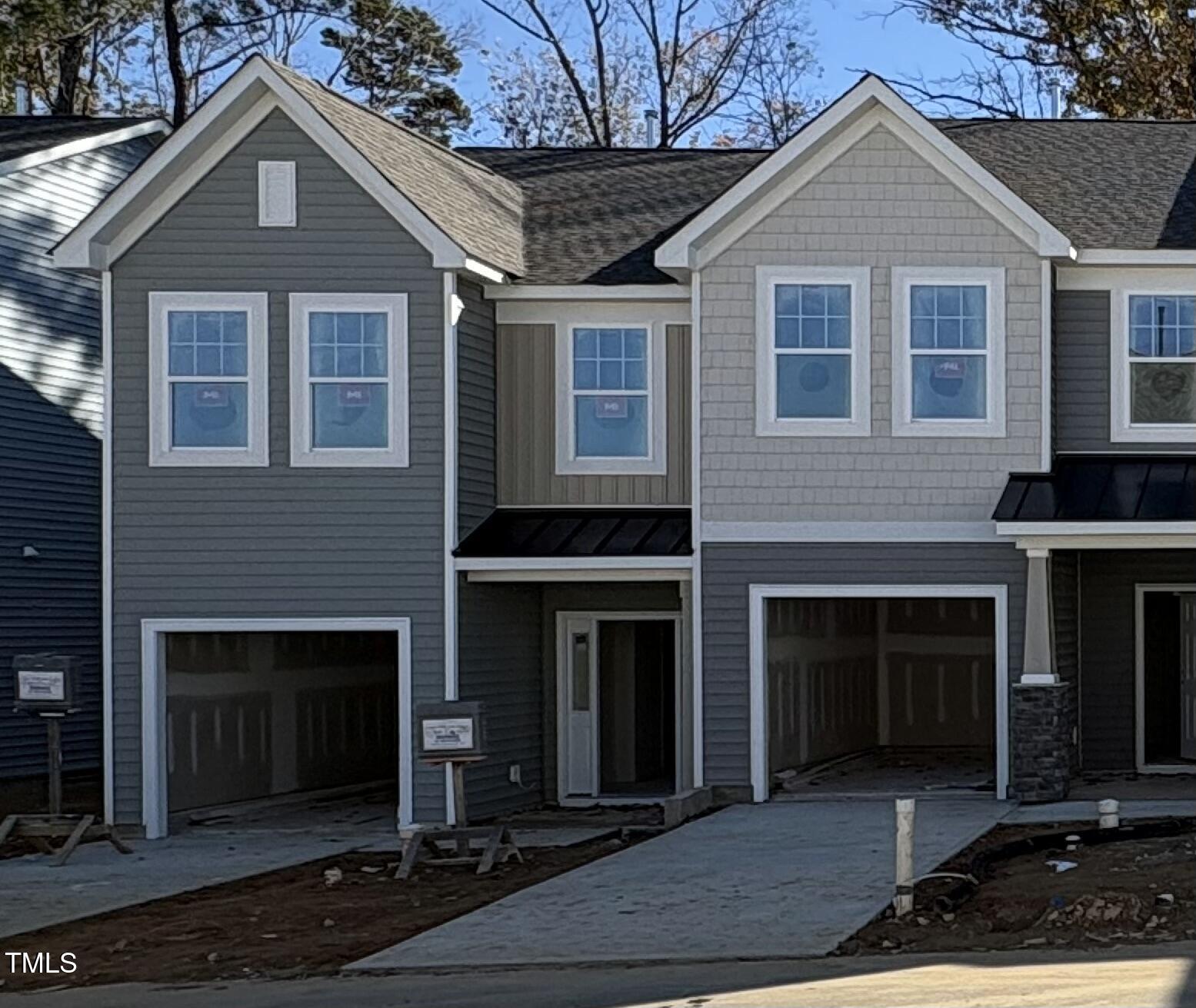 a front view of a house with yard