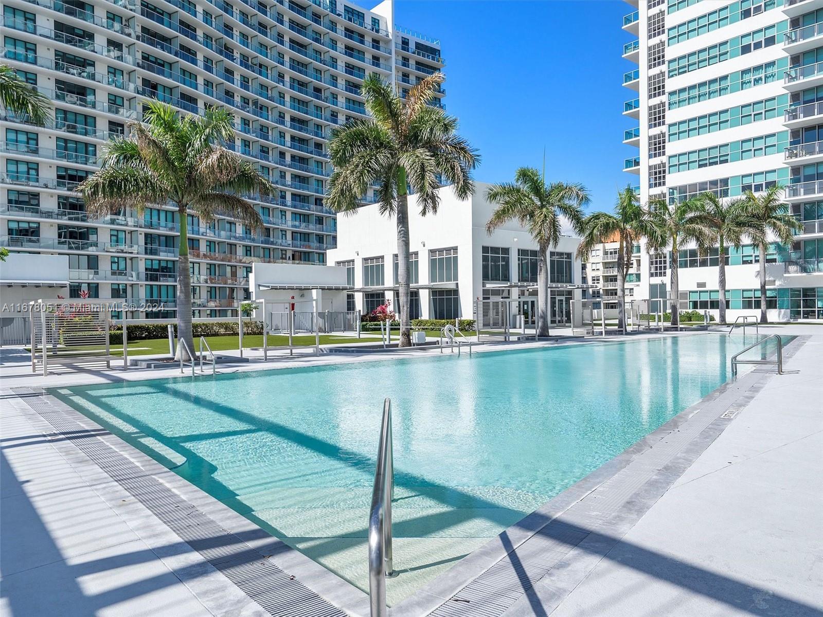 a view of swimming pool with outdoor seating