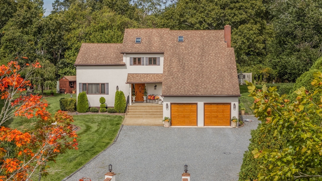 front view of a house with a yard