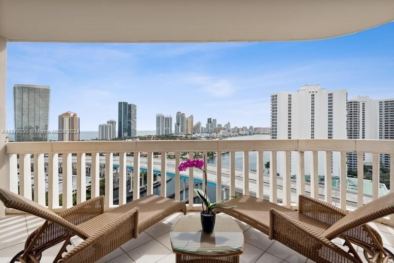 a view of a balcony with wooden floor