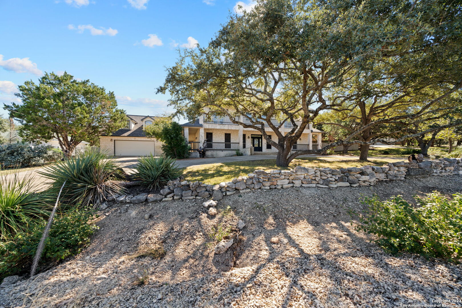 a view of house with outdoor space and sitting area