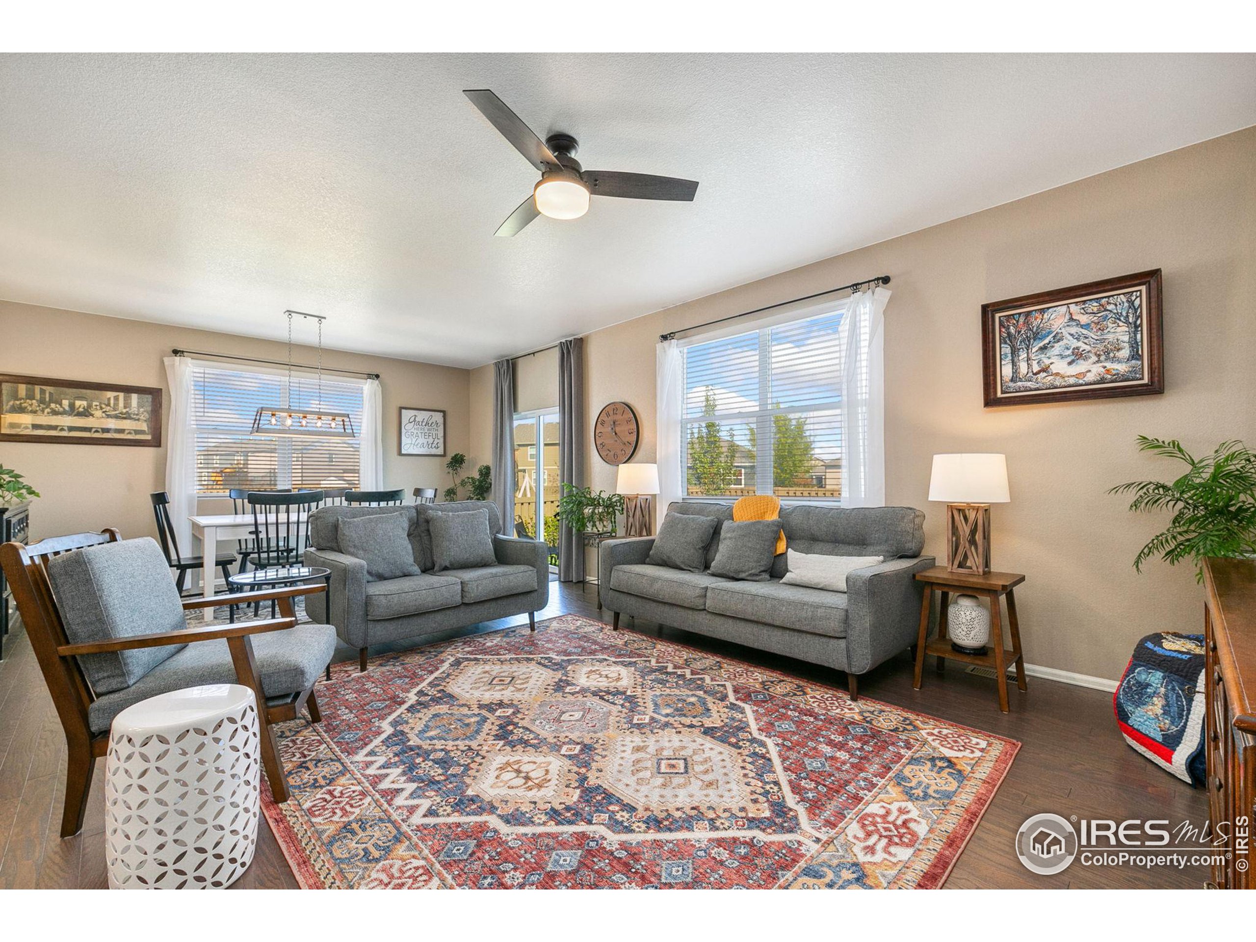 a living room with furniture and a rug