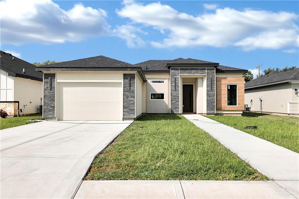 front view of a house with a yard