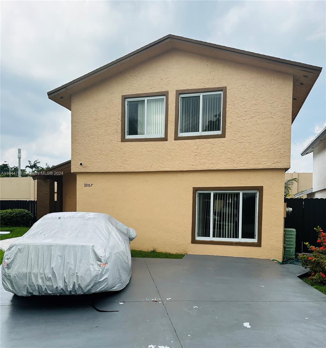 a house view with a backyard space