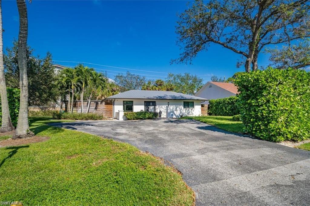 a front view of a house with yard