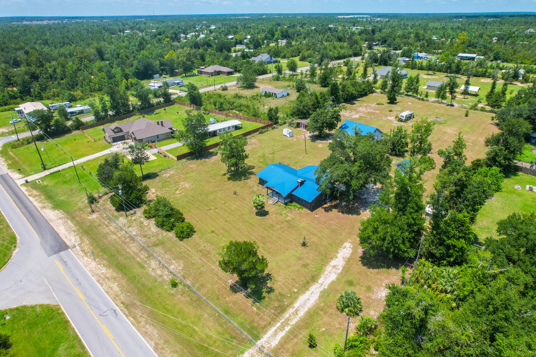 an aerial view of residential houses with outdoor space