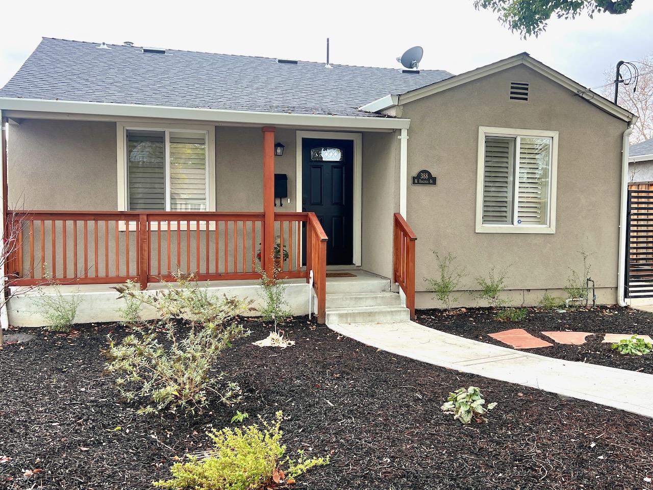 a front view of a house with garden