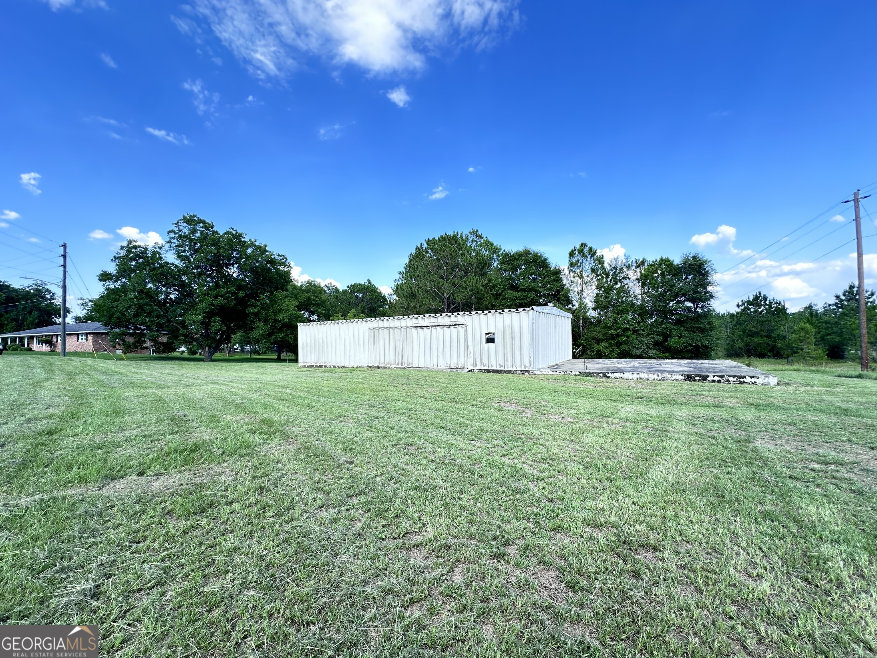 a view of a field with sitting area