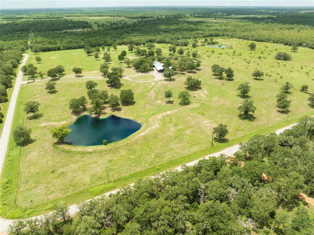 a view of a lake with a yard