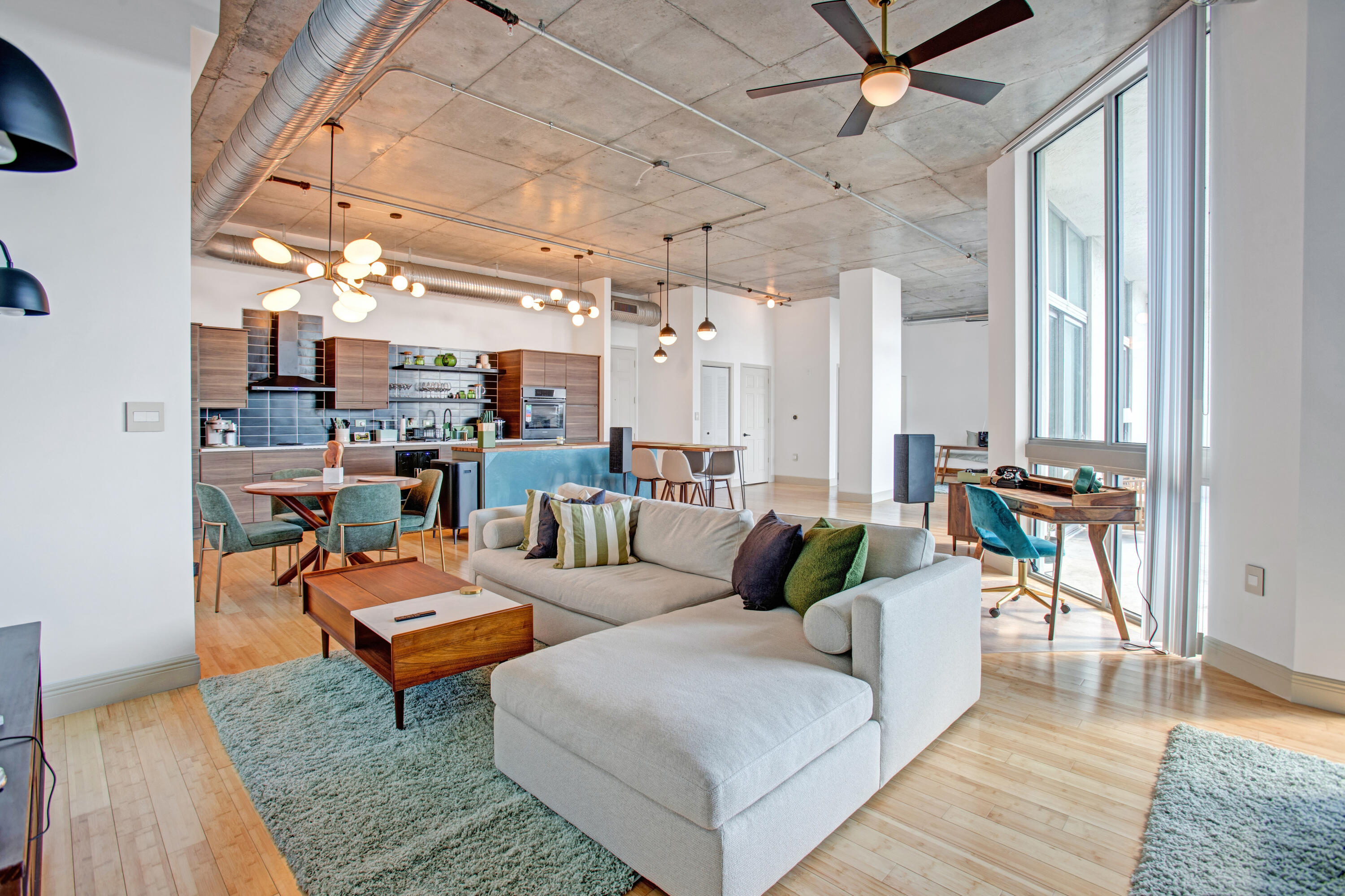 a living room with furniture and a rug