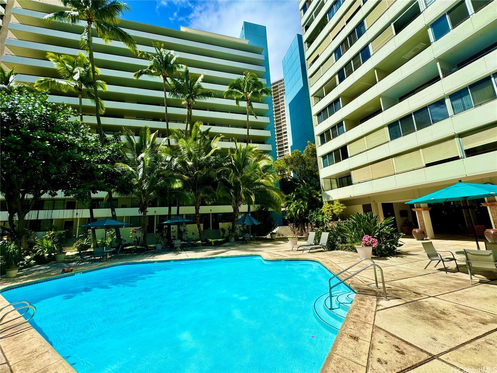 a view of a swimming pool with a patio